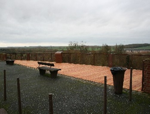 A bench on a walkway AI-generated content may be incorrect.